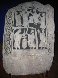 1280px-Drinking_scene_on_an_image_stone.jpg